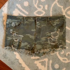 Distressed camo denim shorts